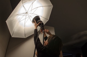 Person setting up a studio light